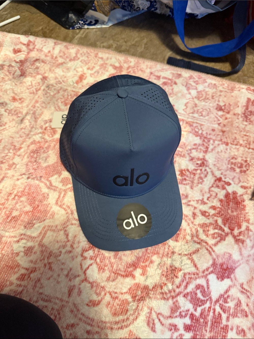 ALO Yoga Perforated Performance Trucker Cap in Navy Blue